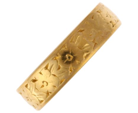 A mid-20th century 22ct gold wedding band ring, maker WW Ltd, London 1961, floral engraved decoration, band width 4.7mm, size