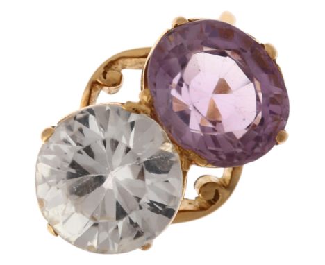 A late 20th century two stone amethyst and rock crystal quartz crossover ring, claw set with oval mixed-cut amethyst  and rou