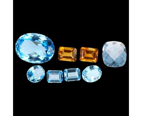 A group of unmounted gemstones, including blue topaz and citrine, largest 19.9 x 14.9 x 9.4mmLot sold as seen unless specific