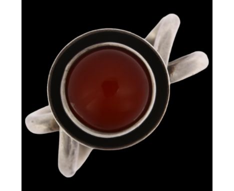 A Danish modernist sterling silver carnelian cup ring, in the style of Niels Erik From, circa 1960s, with crossover shank, se