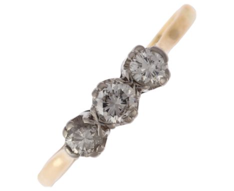 A mid-20th century 18ct gold three stone diamond ring, claw set with modern round brilliant-cut diamonds, total diamond conte