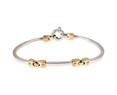 An Italian 18ct two-colour gold bangle bracelet, with screw-head motifs, band width 3mm, internal circumference 19cm, 14.2gNo