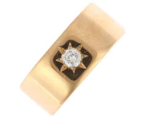 An early 20th century 18ct gold 0.15ct solitaire diamond gypsy ring, indistinct maker, London 1919, star set with modern roun