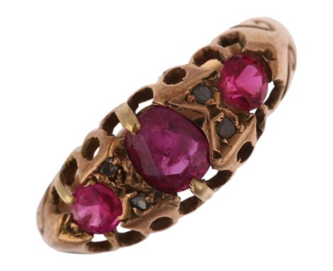 An early 20th century 9ct rose gold seven stone ruby and diamond half hoop ring, indistinct maker, Birmingham 1915, setting h