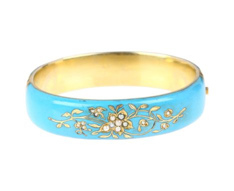 A 19th century Austro-Hungarian silver-gilt blue enamel split pearl hinged bangle, Vienna, engraved floral decoration, greyho