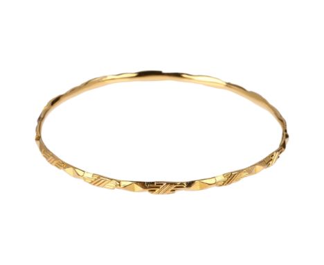 A Middle Eastern slave bangle, unmarked gold settings, band width 3.5mm, internal circumference 21cm, 15.8gNo damage or repai
