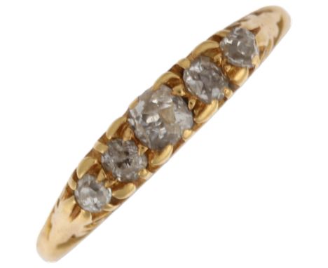 An early 20th century 18ct gold graduated five stone diamond half hoop ring, London 1918, setting height 3.2mm, size I, 1.7gN