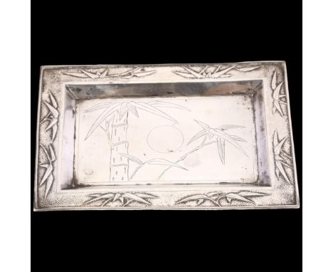 A Chinese export silver dressing table tray, retailed by Tuck Chang, circa 1910, rectangular form, with engraved bamboo reces