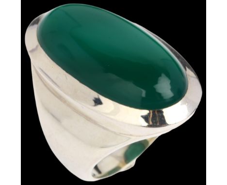 A large sterling silver green chalcedony dress ring, rub-over set with large oval cabochon chalcedony, setting height 33.8mm,