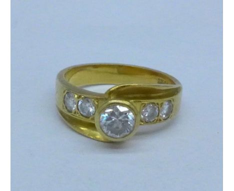 An 18ct gold and five stone diamond ring, 5g, K