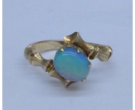 An 18ct gold and opal ring, 2.4g, M