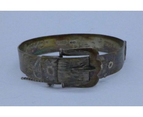 A silver buckle bangle