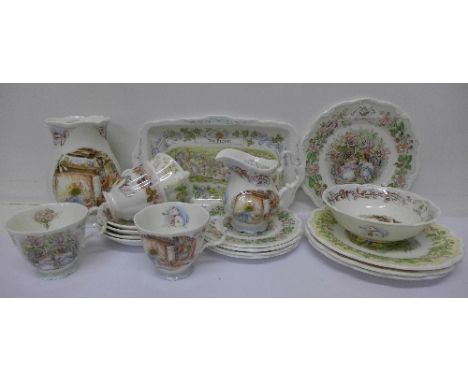 Royal Doulton Brambly Hedge china comprising four medium and small plates, cups, saucers, milk jug, bowl, vase and a rectangu