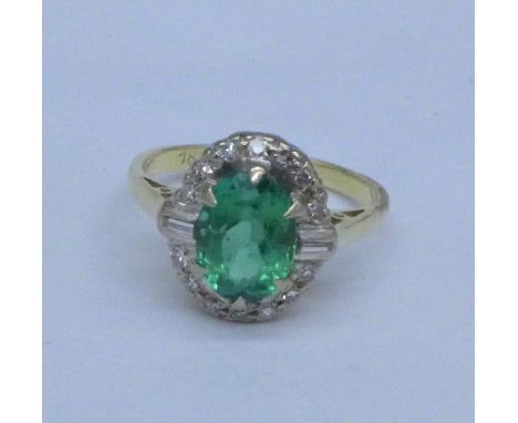 An 18ct gold, diamond and green stone ring, 3.6g, K