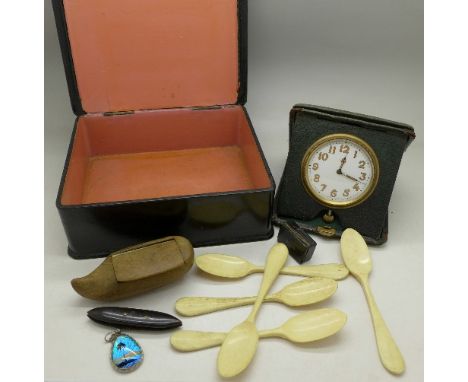 A lacquered box, an 8-Days travel clock, a 19th Century snuff box, five caviar spoons, etc.
