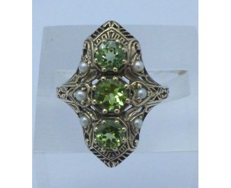 A 9ct gold, peridot and seed pearl ring, 3.9g, O