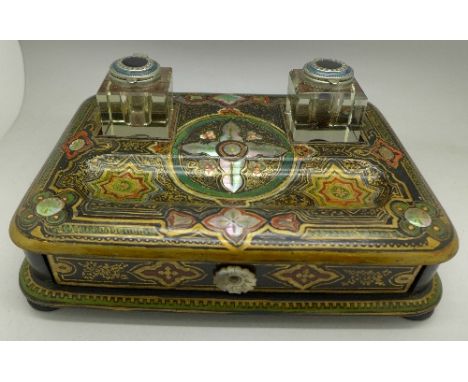 A hand decorated papier-mache inkstand inlaid with mother of pearl