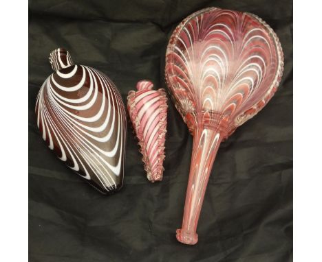 A Nailsea white enamel overlaid ruby glass flask, a Guernsey Island studio glass bowl, cornucopia vase, ruby and white enamel