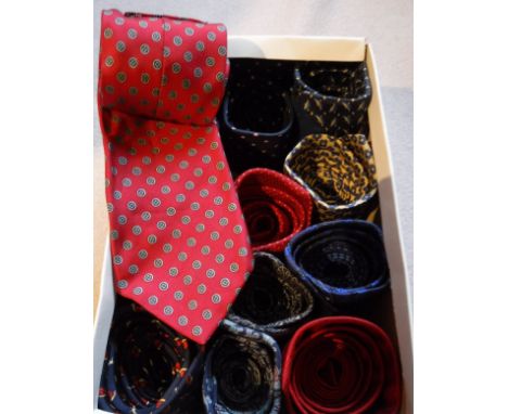 A box containing thirteen silk ties to include Gianni Versace, navy tie with blue ladybirds, a Liberty tie of plain red colou
