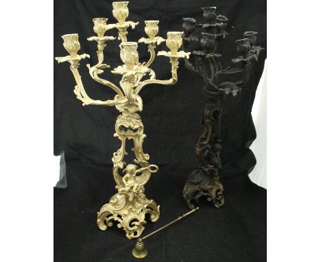 A pair of rococo style six light candelabra with cherubic decoration , together with a modern brass snuffer CONDITION REPORTS