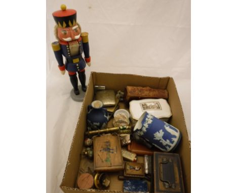 A box of assorted sundry items to include a pin cushion in the form of a shoe, a nut cracker in the form of a German soldier,