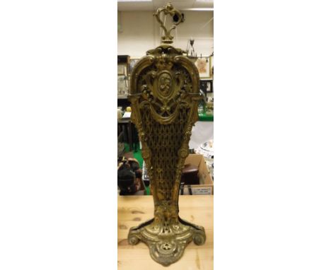A brass folding fire screen of peacock feather/fan form in the Louis XV style