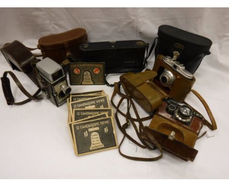 A collection of various camera and optical equipment including a Zeiss Icon camera, Bell & Howell Sundial cine camera, two fu