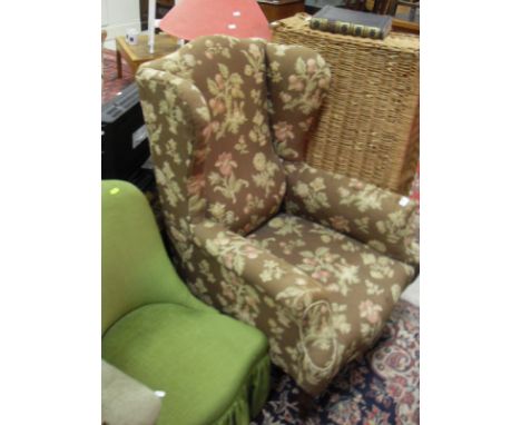 A circa 1900 upholstered wing back scroll armchair on square tapered legs, together with a carbouy table lamp filled with win