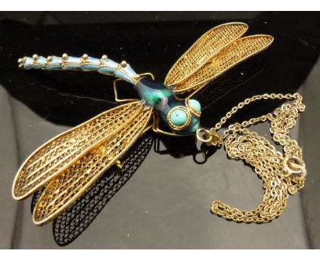 An early 20th Century gilt metal and enamel decorated dragonfly brooch / pendant in the Tiffany manner
