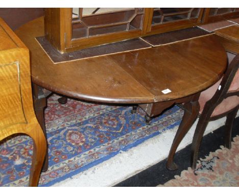 A late George III mahogany oval drop-leaf dining table on cabriole legs to pad feet, together with a mahogany 3 door glazed w