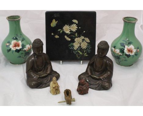 A pair of Japanese cloisonné floral decorated vases on green ground, a pair of bronze Buddha book ends, a Chinese lacquered b