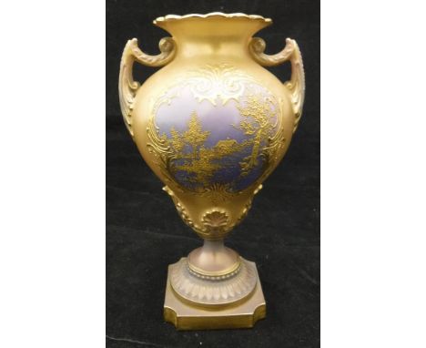 A Royal Worcester gilt decorated vase of pear form, the centre field decorated with cottage amongst trees with floral decorat