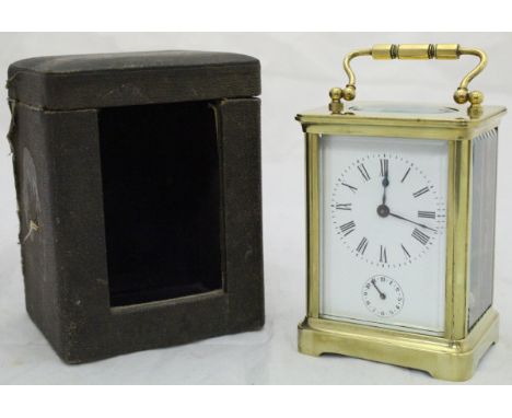 A circa 1900 French lacquered brass cased carriage clock, the dial with Roman numerals and subsidiary dial with Arabic numera