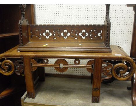 A Chinese rosewood low coffee/opium table, an oak book shelf carved in a gothic manner, a 19th Century shield shaped dressing