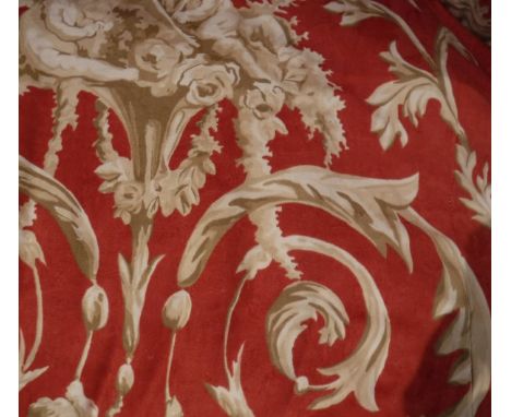 Two pairs of cotton interlined curtains, the red ground set with scrolling acanthus and Classical cherub decoration with matc