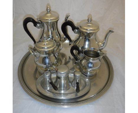 A late 20th Century Etains du Manoir pewter tea service retailed by Christofle, comprising tray, teapot, coffee pot, twin han