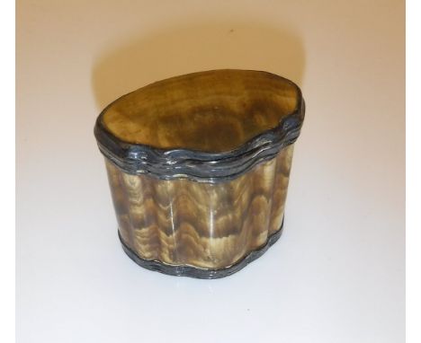 An 18th Century horn snuff box with white metal and gilded mounts of shaped form, indistinctly stamped