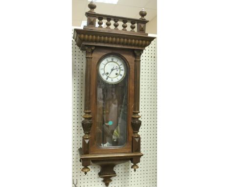 A walnut cased Vienna regulator, the circular enamel dial with Roman numerals inscribed "Ant.Kiffmann Marburg a/drau"