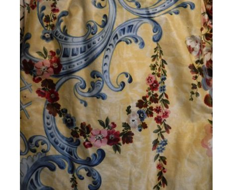 A pair of glazed cotton curtains, the yellow ground with blue scrolls and pink and red floral sprays, together with matching 