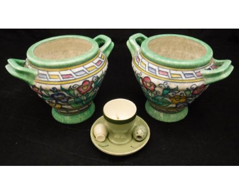 A pair of Charlotte Rhead Crown Ducal vases of ribbed design with tube-lined floral decoration, No'd. to base 213 and 5411, t