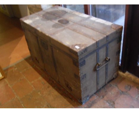 A 19th Century Seaman's chest, iron bound with treated canvas covering, the rising top bearing brass plaque inscribed "Captn 