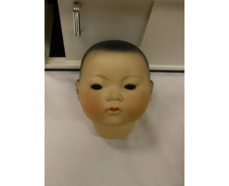 An Armand Marseilles oriental doll mould no 353/3½K with composition body, arms and legs (for restoration) and a CB toy kitch