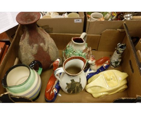 A Sadler race car teapot, a Roskyl pottery jug, French pottery lizard, grape and vine decorated jug, another lizard decorated