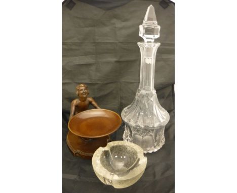 A chocolate patinated bronze figure of a nude proffering a bowl, together with three various decanters, rose bowl, ashtray, s