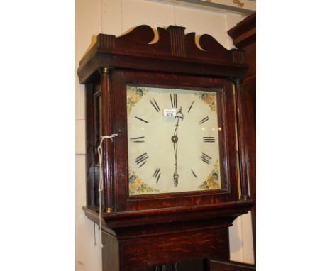 A George III longcase clock with 12 inch square white painted dial with floral spandrels, in oak case, 199cm high