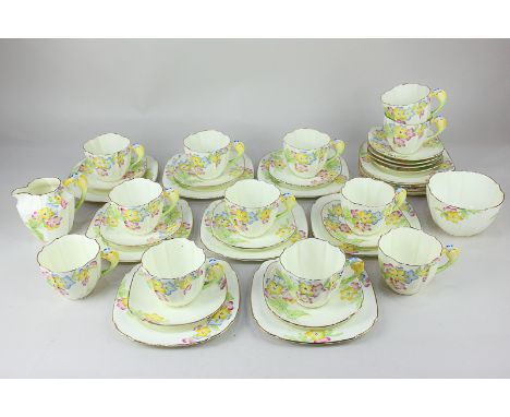 An early 20th century Paragon porcelain part tea set including twelve cups, twelve saucers, twelve tea plates, a milk jug and