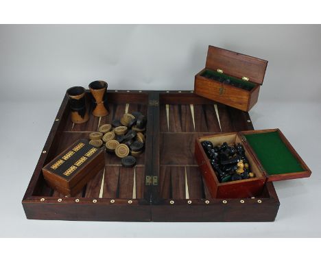 A chessboard and backgammon games box, 46cm, together with a Staunton pattern chess set, a box of dominoes, two shakers, drau