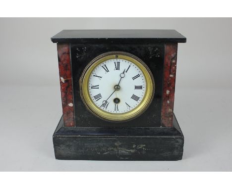 A Victorian black slate mantel clock, the circular enamel dial with Roman numerals, 20cm by 21cm, with key (a/f)