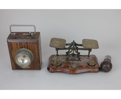 A set of postal scales for letters, with weights, an American multi-head tool by Horace F Britton, and an Ever Ready battery 