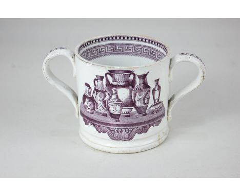 A 19th century two-handled cup decorated in purple with a transfer print of neo-classical vases, and Greek key border
